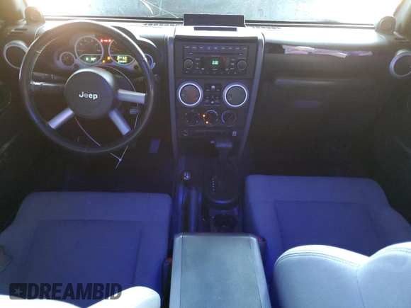 2008 Jeep Wrangler Unlimited Sahara with VIN 1J4GA59108L521910, listed as a Copart auction lot 62330425 with 169,887 mi miles and Salvage title. Bid and sale history available at DreamBid. Image 8.