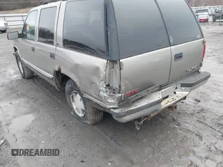 1999 GMC Yukon with VIN 1GKEK13R7XJ753243, listed as a IAAI auction lot 41231957 with 207,092 mi miles. Bid and sale history available at carsss.com. Image 6.
