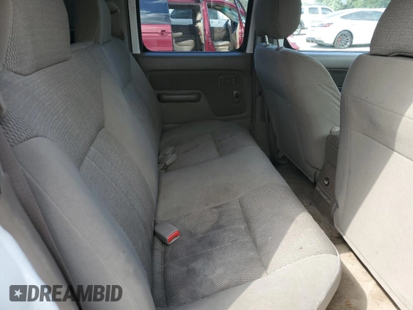 2003 Nissan Frontier XE with VIN 1N6ED29X13C419979, listed as a Copart auction lot 65806585 with 167,535 mi miles and Salvage title. Bid and sale history available at DreamBid. Image 10.