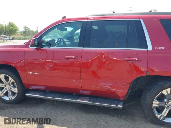 2015 Chevrolet Tahoe LT with VIN 1GNSKBKC6FR628355, listed as a IAAI auction lot 42159743 with 95,730 mi miles and . Bid and sale history available at DreamBid. Image 14.
