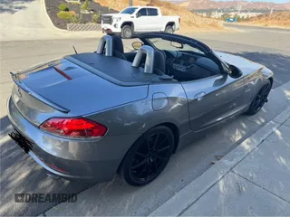 2011 BMW Z4 sDrive35i with VIN WBALM7C57BE383536, listed as a Copart auction lot 49841415 with 107,044 mi miles and Clean Title. Bid and sale history available at carsss.com. Image 4.