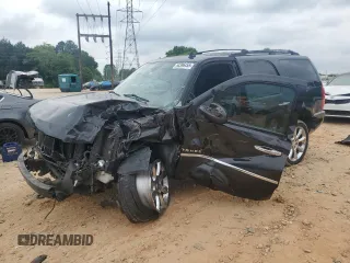 2014 Chevrolet Tahoe LTZ with VIN 1GNSKCE01ER147662, listed as a Copart auction lot 54396455 with 217,228 mi miles and Salvage title. Bid and sale history available at DreamBid. Image 1.