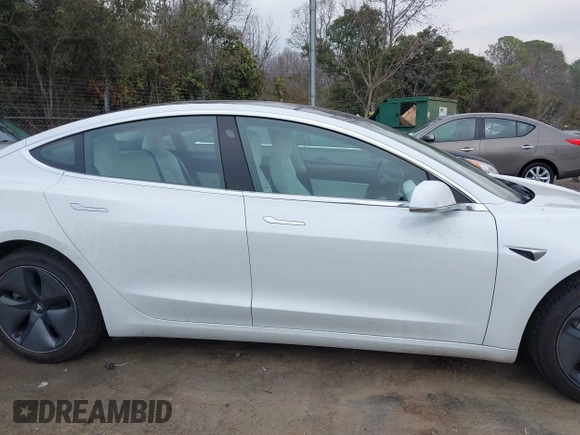 2018 Tesla Model 3 Long Range Battery with VIN 5YJ3E1EB4JF086012, listed as a IAAI auction lot 41683859 with 52,059 mi miles and . Bid and sale history available at DreamBid. Image 13.
