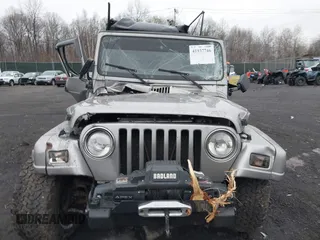 2001 Jeep Wrangler Sport with VIN 1J4FA49S41P355646, listed as a IAAI auction lot 41937746 with 160,634 mi miles. Bid and sale history available at carsss.com. Image 12.