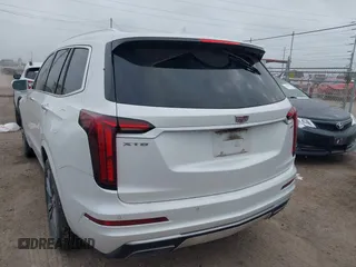 2020 Cadillac XT6 FWD Premium Luxury z VIN 1GYKPCRS2LZ101061, wystawiony jako IAAI lot #42113360 z przebiegiem Nie podano mil oraz . Historia ofert i sprzedaży dostępna na DreamBid. Obrazek 3.