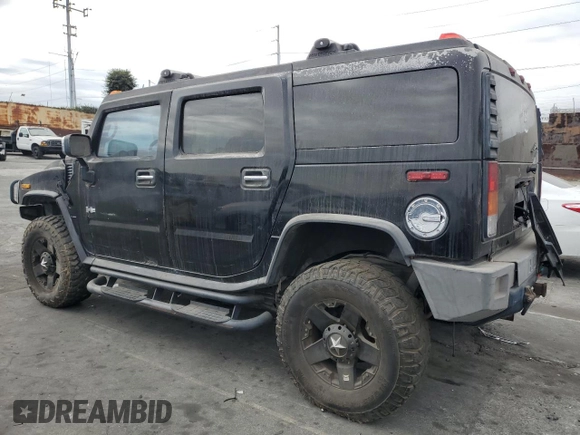 2003 Hummer H2 with VIN 5GRGN23UX3H101416, listed as a Copart auction lot 84423354 with 113,699 mi miles and Clean Title. Bid and sale history available at carsss.com. Image 2.