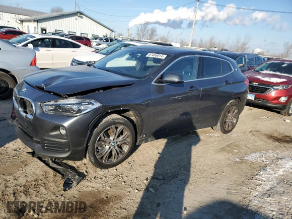 2020 BMW X2 xDrive28i with VIN WBXYJ1C00L5P51384, listed as a Copart auction lot 87406814 with 52,807 mi miles and Salvage Title. Bid and sale history available at carsss.com. Image 1.