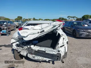 2020 Honda Civic LX z VIN 19XFC2F68LE206395, wystawiony jako IAAI lot #41720356 z przebiegiem 38 037 mil mil oraz . Historia ofert i sprzedaży dostępna na DreamBid. Obrazek 17.