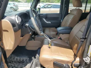 2012 Jeep Wrangler Unlimited Sahara z VIN 1C4HJWEG6CL141988, wystawiony jako Copart lot #61631115 z przebiegiem 140 401 mil mil oraz Szkoda całkowita • Salvage title. Historia ofert i sprzedaży dostępna na DreamBid. Obrazek 7.