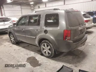 2012 Honda Pilot Touring with VIN 5FNYF4H98CB030879, listed as a IAAI auction lot 41619003 with 201,131 mi miles. Bid and sale history available at carsss.com. Image 3.