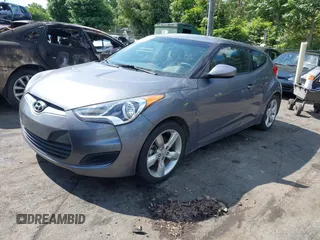 2013 Hyundai Veloster w/Gray Int with VIN KMHTC6ADXDU172104, listed as a IAAI auction lot 42198689 with 67,160 mi miles and . Bid and sale history available at DreamBid. Image 2.