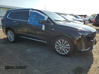 2020 Cadillac XT6 FWD Premium Luxury с VIN 1GYKPCRSXLZ174002, выставлен на аукционе Copart как лот 52083235 с пробегом 79 712 миль миль и Списание • Salvage title. История ставок и продаж доступна на DreamBid. Изображение 4.