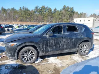 2020 Mazda CX-5 Grand Touring with VIN JM3KFBDM7L1807685, listed as a IAAI auction lot 41392313 with 91,729 mi miles and . Bid and sale history available at carsss.com. Image 14.