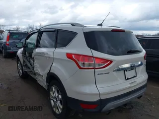 2016 Ford Escape Titanium with VIN 1FMCU9JX9GUA62674, listed as a IAAI auction lot 41838996 with 135,105 mi miles. Bid and sale history available at carsss.com. Image 3.
