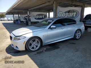 2014 BMW 5 Series 550i xDrive with VIN WBAKP9C55ED693077, listed as a Copart auction lot 64656535 with 107,416 mi miles and Salvage title. Bid and sale history available at DreamBid. Image 1.