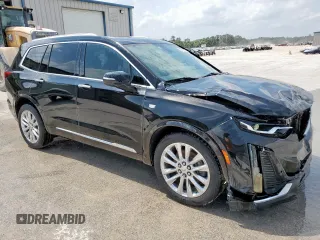 2020 Cadillac XT6 FWD Premium Luxury z VIN 1GYKPCRSXLZ104502, wystawiony jako Copart lot #58211275 z przebiegiem 97 053 mil mil oraz Szkody całkowita. Historia ofert i sprzedaży dostępna na DreamBid. Obrazek 4.