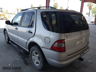 2001 Mercedes-Benz M-Class with VIN 4JGAB54E21A250865, listed as a IAAI auction lot 42111259 with 261,546 mi miles. Bid and sale history available at carsss.com. Image 3.