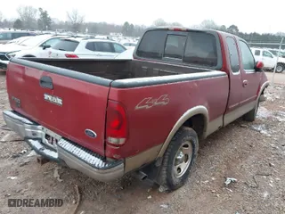 2000 Ford F-150 XL with VIN 1FTRX18L6YNA92785, listed as a IAAI auction lot 41618404 with 136,991 mi miles. Bid and sale history available at carsss.com. Image 4.
