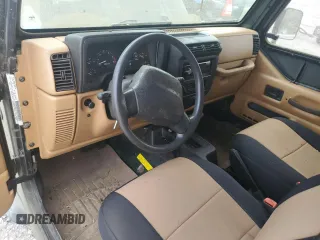 1998 Jeep Wrangler SE with VIN 1J4FY29P8WP784825, listed as a Copart auction lot 61581205 with 148,152 mi miles and Clean title. Bid and sale history available at DreamBid. Image 8.