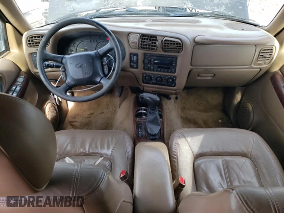 2000 Oldsmobile Bravada z VIN 1GHDT13W3Y2178106, wystawiony jako Copart lot #85069954 z przebiegiem 211 164 mil mil oraz Szkody całkowita. Historia ofert i sprzedaży dostępna na DreamBid. Obrazek 8.