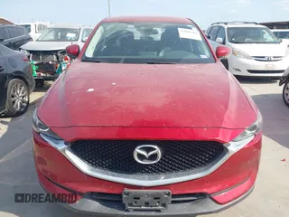 2017 Mazda CX-5 Touring with VIN JM3KFACL3H0195212, listed as a IAAI auction lot 42041361 with 57,377 mi miles and . Bid and sale history available at carsss.com. Image 12.