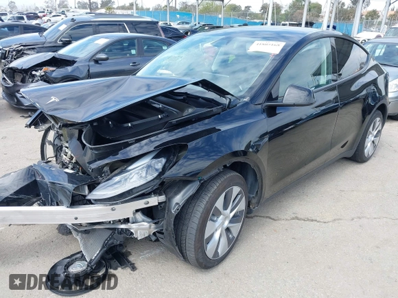 2023 Tesla Model Y Long Range z VIN 7SAYGDEE2PF863200, wystawiony jako IAAI lot #41805168 z przebiegiem 25 480 mil mil oraz . Historia ofert i sprzedaży dostępna na DreamBid. Obrazek 2.