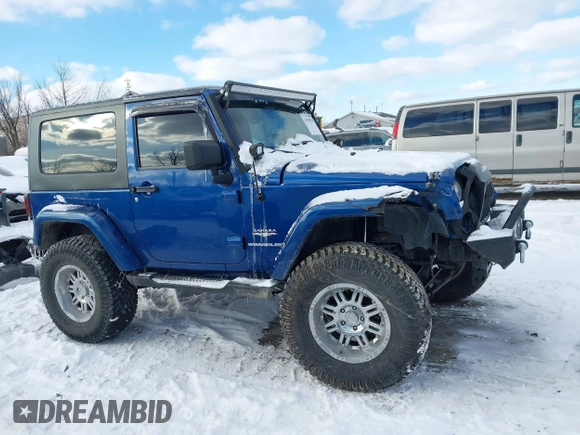 2010 Jeep Wrangler Sahara z VIN 1J4AA5D18AL170957, wystawiony jako IAAI lot #41599820 z przebiegiem 64 217 mil mil oraz . Historia ofert i sprzedaży dostępna na DreamBid. Obrazek 13.