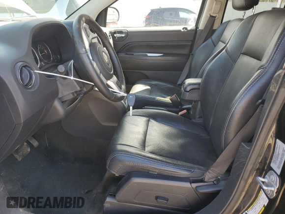 2016 Jeep Compass High Altitude Edition with VIN 1C4NJDEB0GD772702, listed as a Copart auction lot 52634105 with 74,494 mi miles and Salvage Title. Bid and sale history available at carsss.com. Image 7.