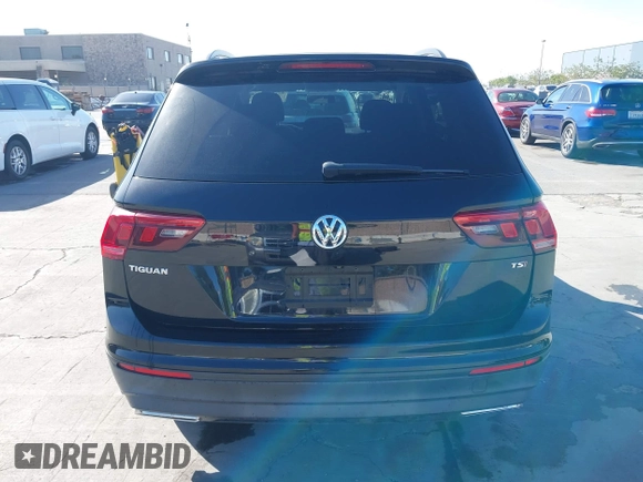 2018 Volkswagen Tiguan S with VIN 3VV1B7AX1JM091928, listed as a IAAI auction lot 42283454 with 53,650 mi miles and . Bid and sale history available at DreamBid. Image 16.