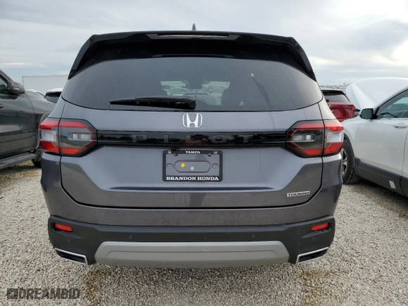 2025 Honda Pilot Touring with VIN 5FNYG2H75SB002553, listed as a Copart auction lot 76869764 with 7,426 mi miles and Salvage Title. Bid and sale history available at carsss.com. Image 6.