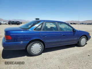1994 Ford Taurus GL z VIN 1FALP5246RG126184, wystawiony jako Copart lot #67615014 z przebiegiem 95 189 mil mil oraz Szkoda całkowita • Salvage title. Historia ofert i sprzedaży dostępna na DreamBid. Obrazek 3.