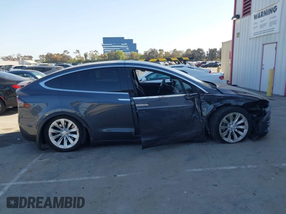 2018 Tesla Model X 75D with VIN 5YJXCDE28JF142509, listed as a IAAI auction lot 41993444 with 100,244 mi miles and . Bid and sale history available at carsss.com. Image 13.