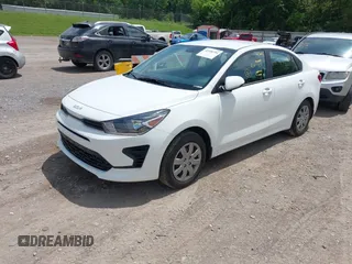 2023 Kia Rio S z VIN 3KPA24ADXPE613557, wystawiony jako IAAI lot #42198794 z przebiegiem 25 275 mil mil oraz . Historia ofert i sprzedaży dostępna na DreamBid. Obrazek 2.