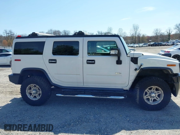 2006 Hummer H2 with VIN 5GRGN23U86H104660, listed as a IAAI auction lot 41933116 with 165,734 mi miles. Bid and sale history available at carsss.com. Image 13.