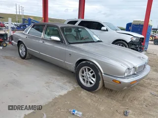1999 Jaguar XJ with VIN SAJHX1043XC856474, listed as a IAAI auction lot 41626649 with 103,266 mi miles and . Bid and sale history available at DreamBid. Image 1.