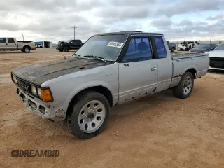 1982 Datsun 720 z VIN JN6MD06S6CW100827, wystawiony jako Copart lot #80042334 z przebiegiem 141 251 mil mil oraz Tytuł czysty. Historia ofert i sprzedaży dostępna na DreamBid. Obrazek 1.