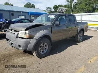 2001 Nissan Frontier SE with VIN 1N6ED27T91C307105, listed as a Copart auction lot 63099535 with 205,487 mi miles and Salvage title. Bid and sale history available at DreamBid. Image 1.