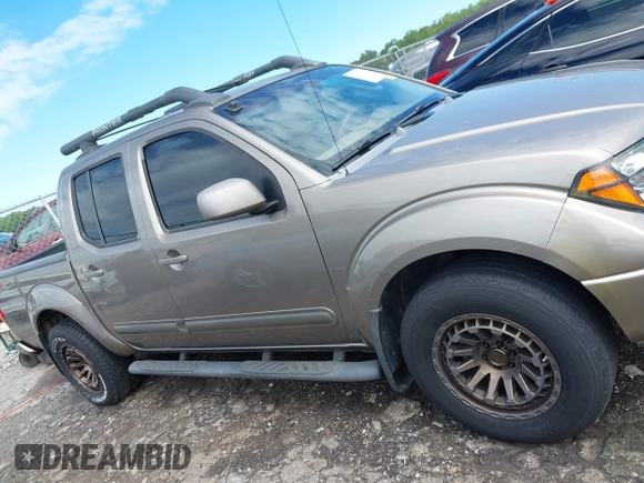 2005 Nissan Frontier LE with VIN 1N6AD07UX5C447844, listed as a IAAI auction lot 42184393 with 202,226 mi miles and . Bid and sale history available at DreamBid. Image 13.