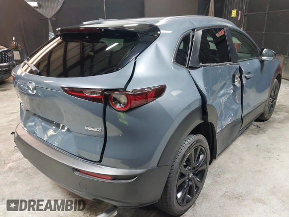 2022 Mazda CX-30 S Carbon Edition with VIN 3MVDMBCL8NM447234, listed as a IAAI auction lot 42511600 with 51,926 mi miles and . Bid and sale history available at DreamBid. Image 4.