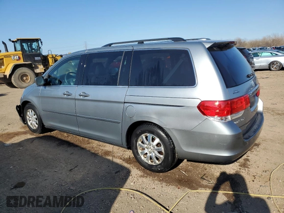 2010 Honda Odyssey EX-L with VIN 5FNRL3H62AB031763, listed as a Copart auction lot 52800055 with 220,450 mi miles and Salvage Title. Bid and sale history available at DreamBid. Image 2.