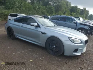 2014 BMW M6 z VIN WBSLX9C53ED160340, wystawiony jako Copart lot #68315924 z przebiegiem 95 899 mil mil oraz Czysty tytuł • Clean title. Historia ofert i sprzedaży dostępna na DreamBid. Obrazek 4.