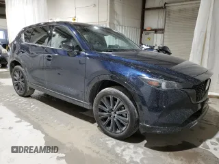 2022 Mazda CX-5 2.5 Turbo with VIN JM3KFBAY1N0636626, listed as a Copart auction lot 52257685 with 41,329 mi miles and Salvage Title. Bid and sale history available at carsss.com. Image 4.
