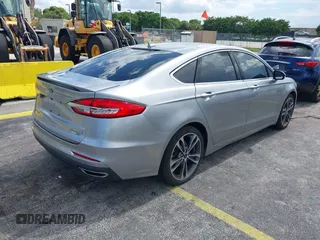 2020 Ford Fusion Titanium with VIN 3FA6P0D95LR199443, listed as a IAAI auction lot 42721371 with 77,592 mi miles and . Bid and sale history available at DreamBid. Image 4.
