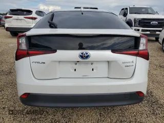 2021 Toyota Prius L Eco с VIN JTDKAMFU5M3142128, выставлен на аукционе Copart как лот 73832324 с пробегом 21 460 миль миль и Списание • Salvage title. История ставок и продаж доступна на DreamBid. Изображение 6.