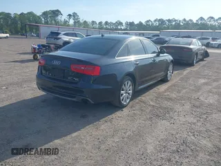 2015 Audi A6 3.0T Prestige with VIN WAUHGAFC3FN011654, listed as a IAAI auction lot 42104153 with 166,719 mi miles. Bid and sale history available at carsss.com. Image 4.