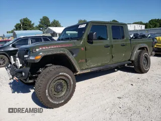2023 Jeep Gladiator Rubicon с VIN 1C6JJTBM0PL586749, выставлен на аукционе Copart как лот 58071174 с пробегом 3 837 миль миль и Списание • Salvage title. История ставок и продаж доступна на DreamBid. Изображение 1.
