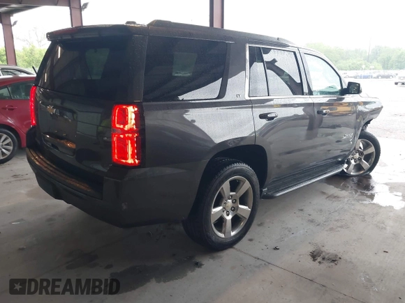 2017 Chevrolet Tahoe LT with VIN 1GNSKBKC8HR326004, listed as a IAAI auction lot 42256494 with 101,486 mi miles and . Bid and sale history available at DreamBid. Image 4.
