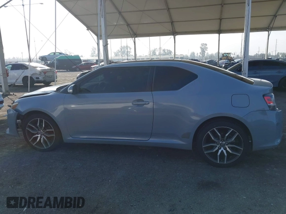 2014 Scion tC with VIN JTKJF5C7XE3079765, listed as a IAAI auction lot 41210220 with 114,410 mi miles. Bid and sale history available at carsss.com. Image 14.
