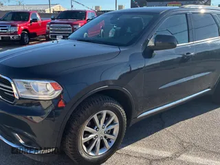 2018 Dodge Durango SXT with VIN 1C4RDJAG0JC111239, listed as a Copart auction lot 56432955 with 146,497 mi miles and Clean Title. Bid and sale history available at DreamBid. Image 2.