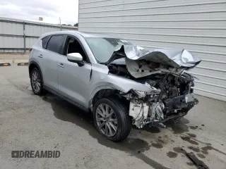 2021 Mazda CX-5 Grand Touring z VIN JM3KFADM7M1339081, wystawiony jako Copart lot #58913585 z przebiegiem Nie podano mil oraz Szkoda całkowita • Salvage title. Historia ofert i sprzedaży dostępna na DreamBid. Obrazek 4.